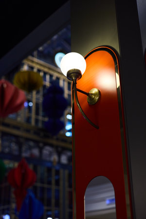 Sophisticated and Elegant Wall Sconce Positioned Perfectly Within a Colorful Decor Setting