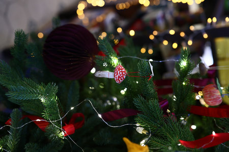 A Beautifully and Festively Decorated Christmas Tree Adorned with Lights and Ornaments