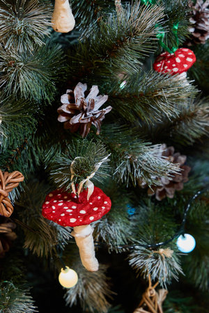 This festive Christmas Tree features Red Mushrooms and Pinecones, enhancing your holiday decorの写真素材