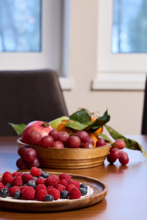 A Beautiful and Colorful Display of Fruits Featuring Freshly Arranged Raspberries and Blueberriesの写真素材