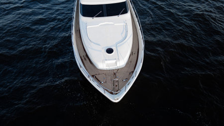 An Elegant Yacht Gracefully Gliding Over the Calm and Serene Waters of the Ocean