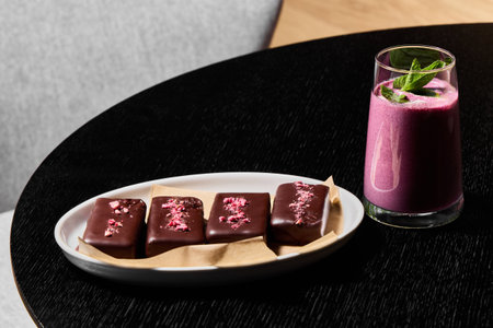 Delicious and Elegant Dark Chocolate Treats Served with a Berry Smoothie Delightful