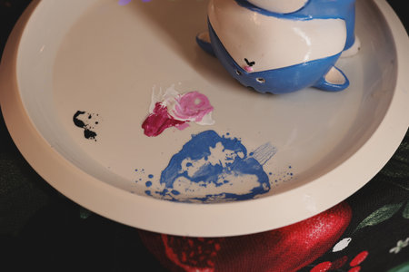 Whimsical Art Displayed on a Beautiful Plate Made with Colorful and Unique Ceramics