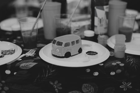 A Vibrant Arts and Crafts Table Featuring a Fun Van Model for Creative Activities and Playの写真素材