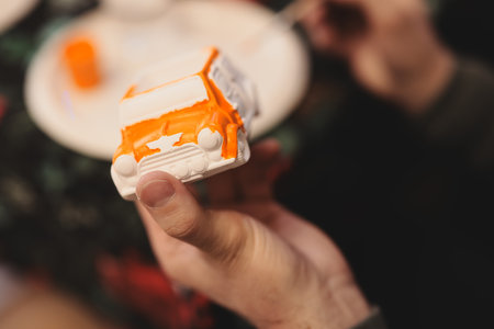 A Creative Painting of a Toy Truck is Currently in Progress and Getting Detailed Touches