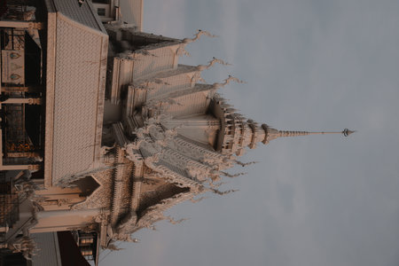 The Intricate Temple Architecture Beautifully Stands Out Under Cloudy Skies at Dusk