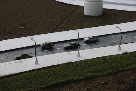 A miniature road scene with toy cars and streetlights encourages imaginative play and creativityの写真素材