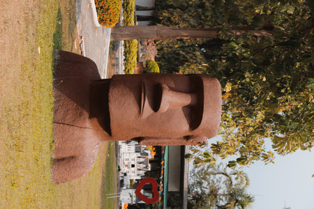 The Moai Statue is located in a beautifully lush green park offering a serene experienceの写真素材