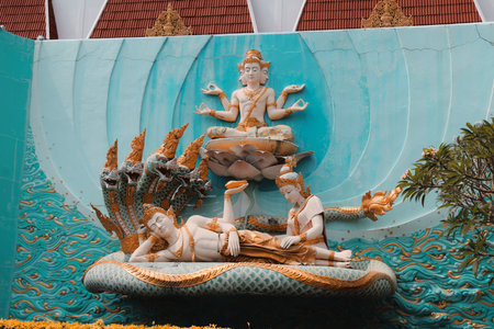 A Serene Hindu Sculpture Beautifully Depicting Various Deities in Vibrant and Rich Colors