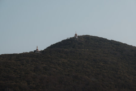 Beautiful Scenic Hilltop Temples Elegantly Surrounded by Lush Nature, Perfect for Explorationの写真素材