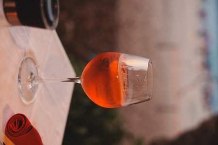 Enjoy a Refreshing Cocktail by the Beach during the Beautiful Sunset Hours by the Oceanの写真素材