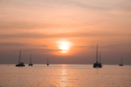 Tranquil Sunset Over YachtFilled Waters, a perfect moment of beauty and bliss awaits youの写真素材
