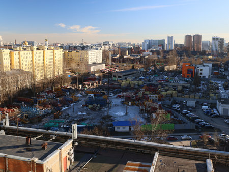 A captivating Urban Landscape that showcases Housing along with Construction Areas thrivesの写真素材