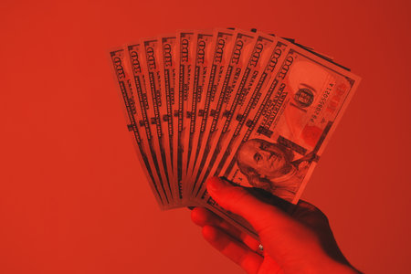 Money in Hand A Powerful Emphasis on Wealth, Prosperity, and Financial Stability for Allの写真素材