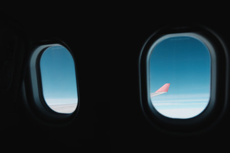 InFlight Views Through Airplane Windows A Unique Perspective Above the Clouds and Horizon