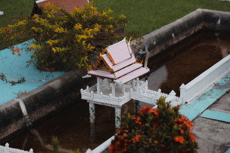 The Beautiful Miniature Thai Architecture Featuring Stunning Water Features and Detailsの写真素材