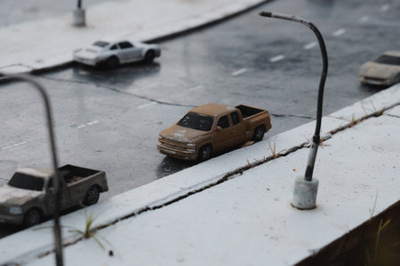 A Realistic and Detailed Model of a City Street Featuring Vehicles and Streetlightsの写真素材