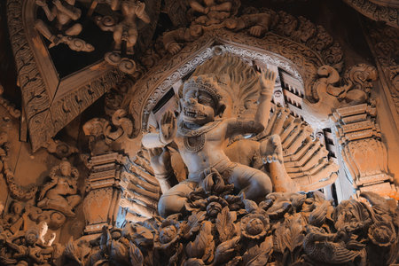 An Intricate Carving that Depicts a Divine Figure Enclosed Within Ornate Architectureの写真素材