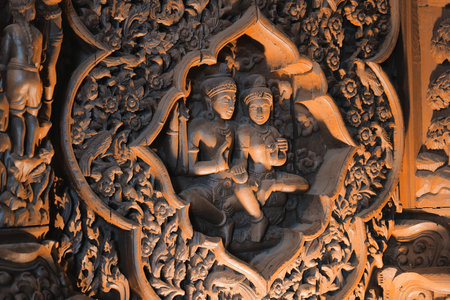 A stunningly intricate and beautifully carved artwork that expertly depicts an embrace in stoneの写真素材