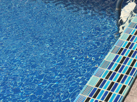 The swimming pools water surface is beautifully clear, inviting, and delightfulの写真素材