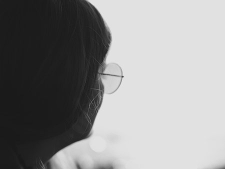 A Thoughtful Individual Captured in Black and White Imagery and Artistic Photographyの写真素材