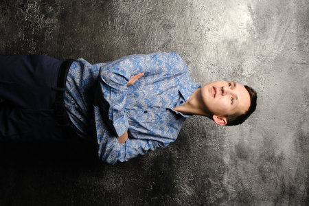 A Stylish Young Man Wearing an Elegant Shirt Posing Confidentlyの写真素材
