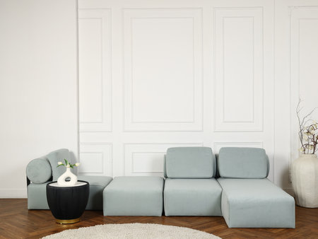 A modern modular sofa in a refreshing light blue hue, perfect for creating chic interiorsの写真素材