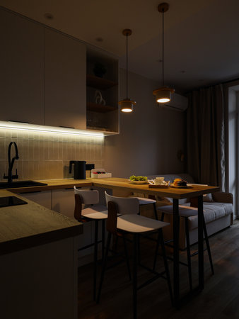 This is a modern, cozy kitchen designed with beautiful ambient lighting to enhance the vibeの写真素材