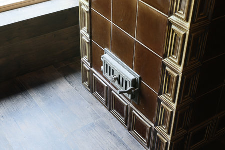 A Stylish Vent Cover Located on a Vintage Tile Wall Adds Unique Aesthetic Appeal and Characterの写真素材