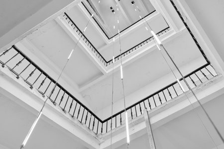 Explore Modern Architectural Design That Showcases a Unique Staircase and Stunning Lighting Featuresの写真素材