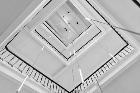 Captivating and Stunning Architectural Spiral View Captured from Below in the Cityscapeの写真素材