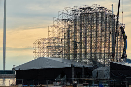 The Current Progress of Construction on a Modern Buildings Framework During Sunset Hoursの写真素材