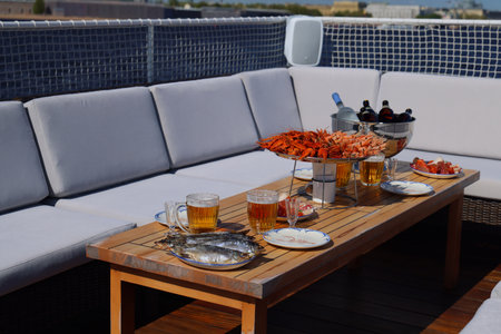 An Elegant Rooftop Gathering Featuring Delicious Food and Refreshing Drinks for Everyone