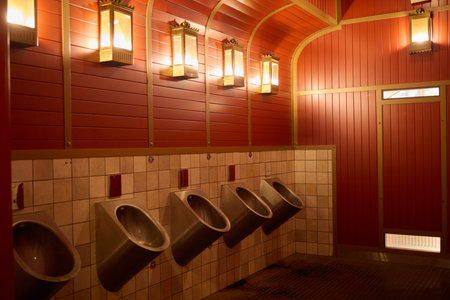 This modern mens restroom features unique design elements for enhanced appeal and functionality
