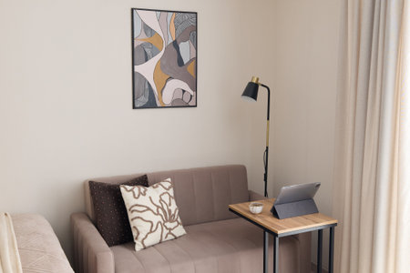 A stylish living room with art and furniture that enhances comfort and invites relaxation