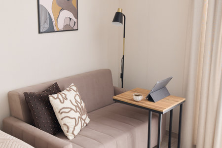 The Modern Living Room combines a Cozy Sofa and efficient Desk, inviting comfort and style