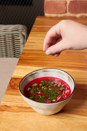 Indulge in a delightful and vibrant beetroot soup thats beautifully garnished with fresh herbs