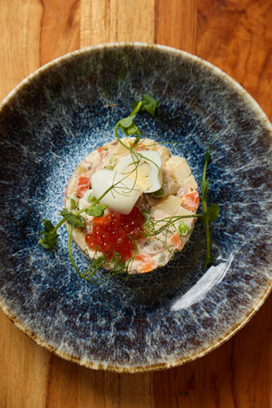 An Elegant Seafood Dish beautifully presented with exquisite caviar and vibrant microgreensの写真素材