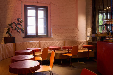 The interior of the cozy cafe features bright colors complemented by plenty of natural light