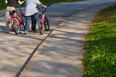 Bicycle Riders Relishing a Beautiful, Sunny Day on a Scenic, Picturesque Pathway