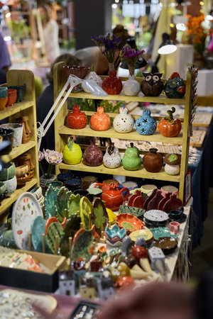 Explore a Variety of Colorful Handcrafted Pottery and Unique Decorative Items at the Marketの写真素材