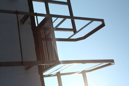 Exploring Modern Architectural Elements Emphasized by Bright Sunlight and Its Effectsの写真素材