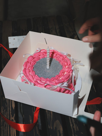 A Bright and Colorful Birthday Cake Elegantly Presented in a Creative and Unique Boxの写真素材