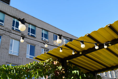 A Cozy Outdoor Patio Enhanced with String Lights Set Against a Beautiful Clear Sky at Night
