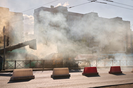 A smokefilled urban conflict scene is unfolding, showcasing barriers in the city environment