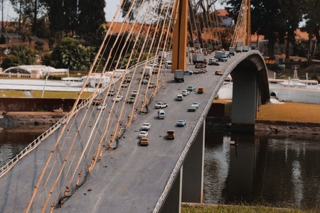 An Aerial View of a Beautiful Bridge Featuring Traffic Flowing Amidst Scenic Surroundingsの写真素材