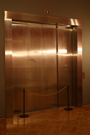 The Contemporary Design of a Modern Stainless Steel Elevator Entrance Reflects Elegance and Utilityの写真素材