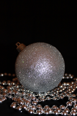 Metallic Christmas bauble isolated on black background の写真素材