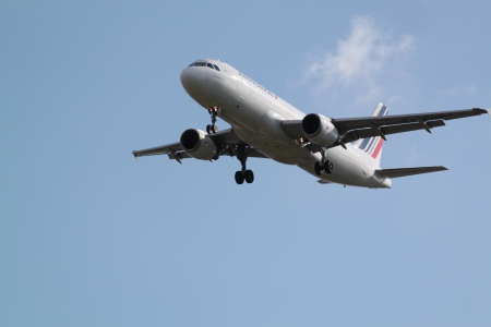  Large passenger airplane flying in the blue sky PARIS - MAY 12, 2012  Plane of Air France company flying to Orly Airport, Paris, France  のeditorial素材