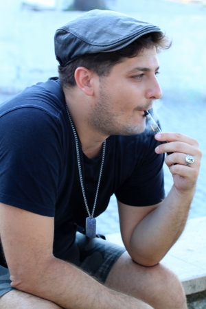 Young man smoking an elektronic cigarette